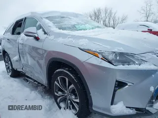 2018 Lexus RX 350L Premium z VIN JTJDZKCA9J2008933, wystawiony jako IAAI lot #41600527 z przebiegiem 93 423 mil mil oraz . Historia ofert i sprzedaży dostępna na DreamBid. Obrazek 13.