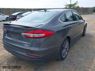 2020 Ford Fusion Hybrid Titanium with VIN 3FA6P0RU0LR141494, listed as a IAAI auction lot 39967898 with 88,152 mi miles. Bid and sale history available at carsss.com. Image 4.