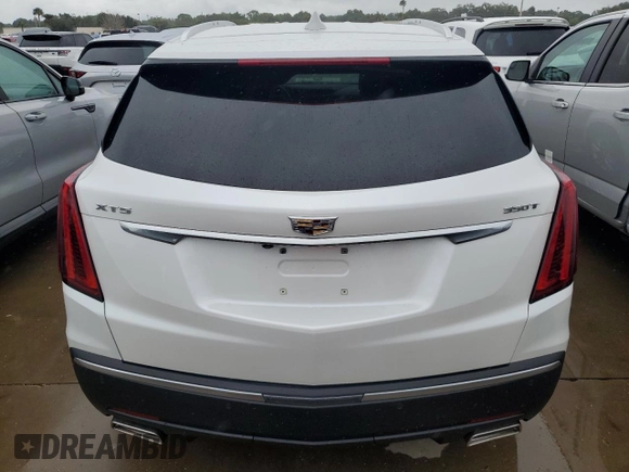 2022 Cadillac XT5 FWD Luxury z VIN 1GYKNAR48NZ163921, wystawiony jako Copart lot #74507874 z przebiegiem 5 723 mil mil oraz Nie do naprawy • Non repairable. Historia ofert i sprzedaży dostępna na DreamBid. Obrazek 6.