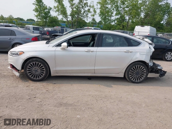 2017 Ford Fusion Titanium z VIN 3FA6P0K92HR396113, wystawiony jako IAAI lot #42402969 z przebiegiem 185 620 mil mil oraz . Historia ofert i sprzedaży dostępna na DreamBid. Obrazek 14.