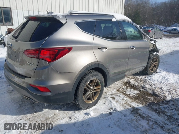 2017 Hyundai Santa Fe 2.4L with VIN 5NMZUDLB4HH034437, listed as a IAAI auction lot 41565545 with 96,640 mi miles and . Bid and sale history available at DreamBid. Image 4.