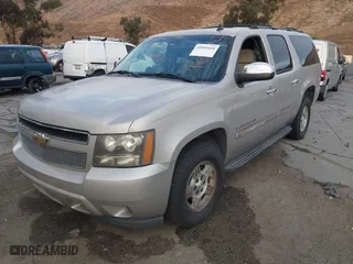 2007 Chevrolet Suburban LT with VIN 1GNFC16007R231427, listed as a IAAI auction lot 40995668 with 168,691 mi miles. Bid and sale history available at carsss.com. Image 2.