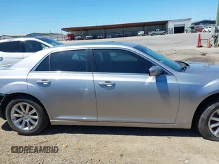 2014 Chrysler 300 with VIN 2C3CCAAG8EH264595, listed as a IAAI auction lot 42076996 with 101,659 mi miles and . Bid and sale history available at DreamBid. Image 14.