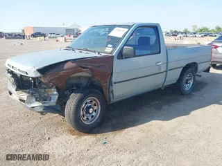 1990 Nissan Trucks 2WD XE with VIN 1N6SD11S4LC400985, listed as a IAAI auction lot 41986390 with 189,924 mi miles. Bid and sale history available at carsss.com. Image 2.