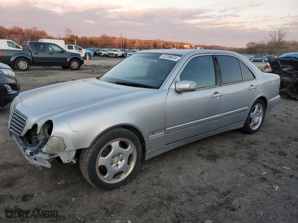 2000 Mercedes-Benz E-Class with VIN WDBJF70J7YB049473, listed as a Copart auction lot 82396624 with 197,515 mi miles and Salvage Title. Bid and sale history available at carsss.com. Image 1.