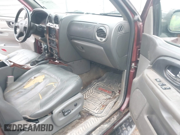 2003 GMC Envoy SLT z VIN 1GKDS13S532314397, wystawiony jako IAAI lot #41184274 z przebiegiem 232 750 mil mil oraz . Historia ofert i sprzedaży dostępna na DreamBid. Obrazek 5.