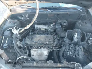 1999 Mitsubishi Mirage DE z VIN JA3AY26A0XU017889, wystawiony jako IAAI lot #40457172 z przebiegiem Nie podano mil oraz . Historia ofert i sprzedaży dostępna na DreamBid. Obrazek 10.