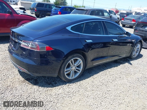 2014 Tesla Model S 60 with VIN 5YJSA1H18EFP31969, listed as a IAAI auction lot 42312485 with 90,043 mi miles and . Bid and sale history available at DreamBid. Image 4.
