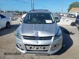 2016 Ford Escape Titanium with VIN 1FMCU0J94GUB11776, listed as a IAAI auction lot 41945655 with 119,949 mi miles. Bid and sale history available at carsss.com. Image 12.