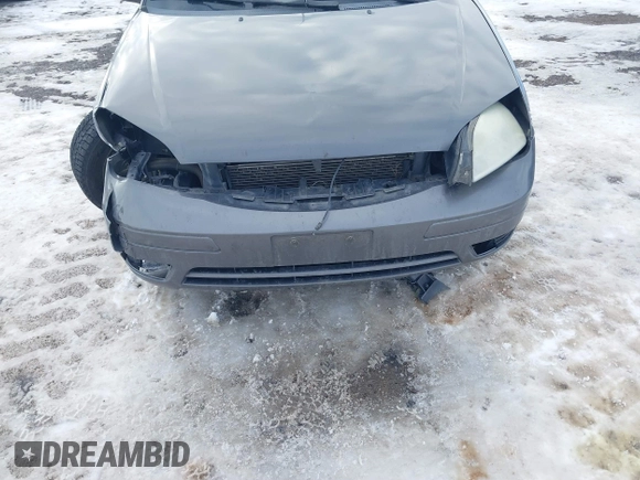 2007 Ford Focus S z VIN 1FAHP31N87W243692, wystawiony jako IAAI lot #41312958 z przebiegiem 184 717 mil mil oraz . Historia ofert i sprzedaży dostępna na DreamBid. Obrazek 6.