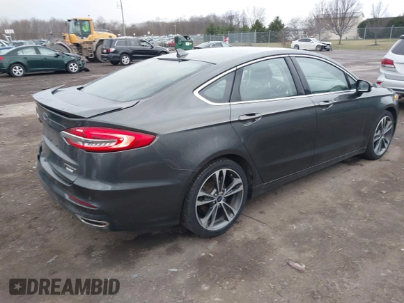 2019 Ford Fusion Titanium with VIN 3FA6P0K9XKR259556, listed as a IAAI auction lot 41823997 with 132,071 mi miles. Bid and sale history available at carsss.com. Image 4.