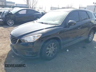 2016 Mazda CX-5 Sport with VIN JM3KE4BY3G0843177, listed as a IAAI auction lot 41804094 with 193,461 mi miles. Bid and sale history available at carsss.com. Image 17.