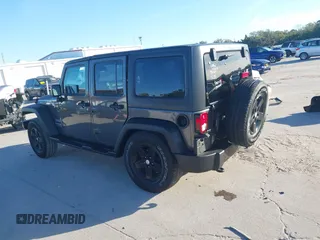 2018 Jeep Wrangler JK Unlimited Sport S with VIN 1C4BJWDG3JL900973, listed as a IAAI auction lot 41239817 with 50,952 mi miles. Bid and sale history available at carsss.com. Image 15.