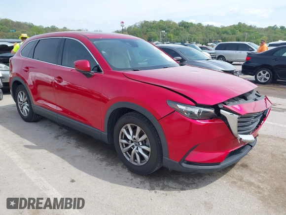 2016 Mazda CX-9 Touring with VIN JM3TCACY4G0112961, listed as a IAAI auction lot 42094718 with 114,679 mi miles and . Bid and sale history available at DreamBid. Image 1.