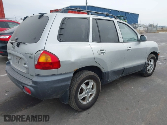 2003 Hyundai Santa Fe LX with VIN KM8SC73E83U568666, listed as a IAAI auction lot 41679044 with 127,560 mi miles. Bid and sale history available at carsss.com. Image 4.