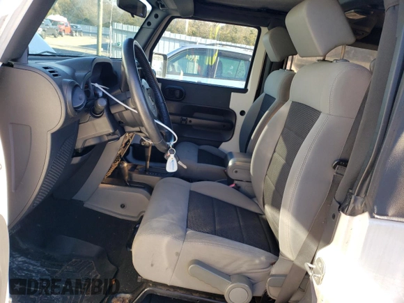 2010 Jeep Wrangler Rubicon with VIN 1J4BA6D17AL132002, listed as a Copart auction lot 83869124 with 183,507 mi miles and Salvage title. Bid and sale history available at DreamBid. Image 7.