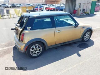 2004 MINI Hardtop with VIN WMWRC33474TC48930, listed as a IAAI auction lot 41657936 with 147,422 mi miles and . Bid and sale history available at DreamBid. Image 4.