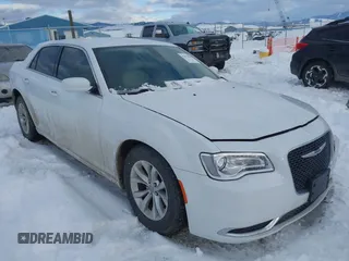 2015 Chrysler 300 Limited with VIN 2C3CCAAG3FH779571, listed as a IAAI auction lot 41579698 with 141,131 mi miles. Bid and sale history available at carsss.com. Image 1.