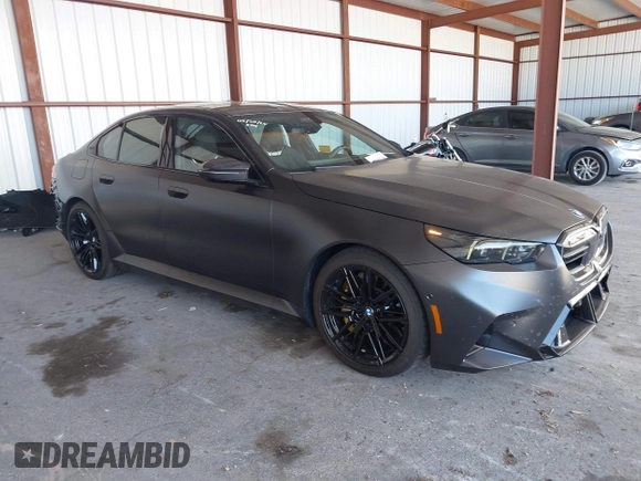 2025 BMW 5 Series with VIN WBS83FK04SCU11874, listed as a IAAI auction lot 42543784 with 4,517 mi miles and . Bid and sale history available at DreamBid. Image 1.