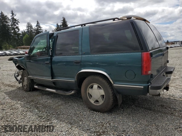 1998 Chevrolet Tahoe z VIN 1GNEK13R2WJ304666, wystawiony jako Copart lot #57833815 z przebiegiem 199 103 mil mil oraz Szkoda całkowita • Salvage title. Historia ofert i sprzedaży dostępna na DreamBid. Obrazek 2.