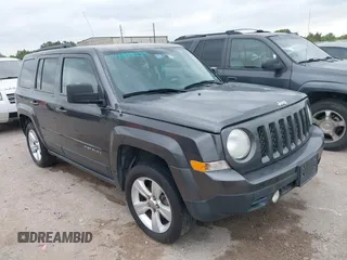 2014 Jeep Patriot Latitude with VIN 1C4NJRFB3ED810819, listed as a IAAI auction lot 41994129 with 145,733 mi miles and . Bid and sale history available at carsss.com. Image 1.