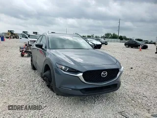 2023 Mazda CX-30 S Carbon Edition z VIN 3MVDMBCM2PM539130, wystawiony jako Copart lot #54817735 z przebiegiem 29 678 mil mil oraz Szkoda całkowita • Salvage title. Historia ofert i sprzedaży dostępna na DreamBid. Obrazek 14.