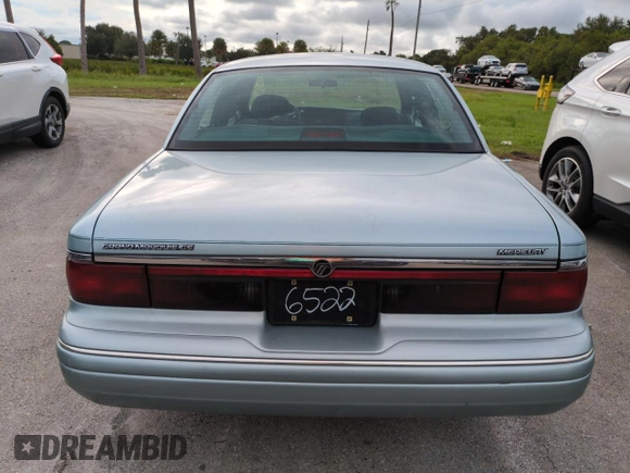 1996 Mercury Grand Marquis GS with VIN 2MELM74W5TX653873, listed as a Copart auction lot 74659254 with 86,589 mi miles and Salvage Title. Bid and sale history available at DreamBid. Image 6.