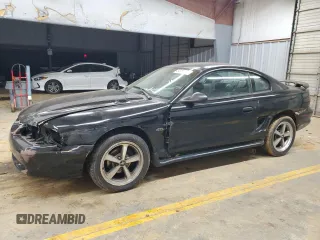 1997 Ford Mustang GT with VIN 1FALP42X4VF192088, listed as a Copart auction lot 84714114 with 194,845 mi miles and Salvage title. Bid and sale history available at DreamBid. Image 1.
