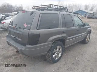 2002 Jeep Grand Cherokee Laredo with VIN 1J4GW48S92C294116, listed as a IAAI auction lot 42080375 with 154,108 mi miles and . Bid and sale history available at DreamBid. Image 4.