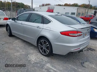 2019 Ford Fusion Titanium with VIN 3FA6P0K96KR120749, listed as a IAAI auction lot 40737085 with 118,376 mi miles and . Bid and sale history available at DreamBid. Image 3.
