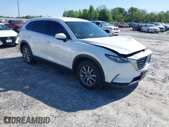 2019 Mazda CX-9 Touring z VIN JM3TCACY3K0333931, wystawiony jako IAAI lot #41968519 z przebiegiem 102 992 mil mil oraz . Historia ofert i sprzedaży dostępna na DreamBid. Obrazek 1.