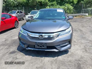 2016 Honda Accord Touring with VIN 1HGCR3F94GA009459, listed as a IAAI auction lot 42597128 with 182,977 mi miles and . Bid and sale history available at DreamBid. Image 12.