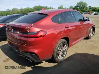 2021 BMW X4 M40i with VIN 5UX2V5C0XM9E78318, listed as a Copart auction lot 57834645 with 67,277 mi miles and Salvage title. Bid and sale history available at DreamBid. Image 3.