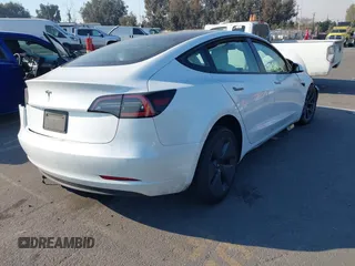 2022 Tesla Model 3 with VIN 5YJ3E1EA4NF319237, listed as a IAAI auction lot 41263761 with 44,384 mi miles and . Bid and sale history available at DreamBid. Image 4.