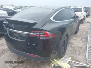 2021 Tesla Model X Long Range Plus with VIN 5YJXCAE27MF324270, listed as a IAAI auction lot 41886101 with 59,614 mi miles and . Bid and sale history available at carsss.com. Image 4.