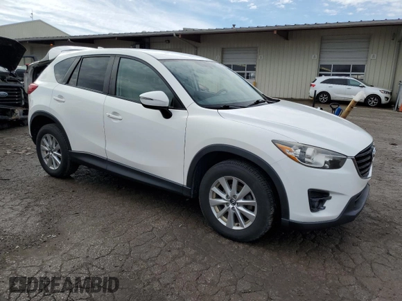 2016 Mazda CX-5 Touring with VIN JM3KE4CY7G0821701, listed as a Copart auction lot 43805495 with 144,416 mi miles and Salvage Title. Bid and sale history available at carsss.com. Image 4.