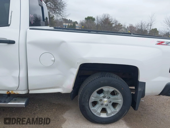 2014 Chevrolet Silverado 1500 LT with VIN 3GCUKREC6EG194197, listed as a IAAI auction lot 41999718 with 206,916 mi miles and . Bid and sale history available at DreamBid. Image 19.