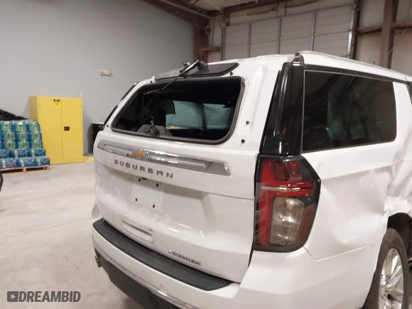 2023 Chevrolet Suburban Premier with VIN 1GNSCFKD8PR299995, listed as a IAAI auction lot 41607729 with 64,549 mi miles. Bid and sale history available at carsss.com. Image 13.