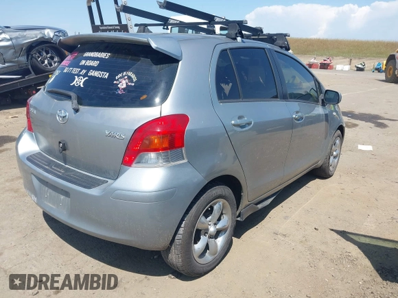 2009 Toyota Yaris with VIN JTDKT903195235991, listed as a IAAI auction lot 42164989 with 249,389 mi miles. Bid and sale history available at carsss.com. Image 4.