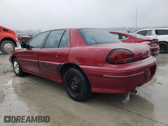 1997 Pontiac Grand Am SE z VIN 1G2NE52T4VC747929, wystawiony jako Copart lot #43959975 z przebiegiem 142 673 mil mil oraz Szkoda całkowita • Salvage title. Historia ofert i sprzedaży dostępna na DreamBid. Obrazek 2.