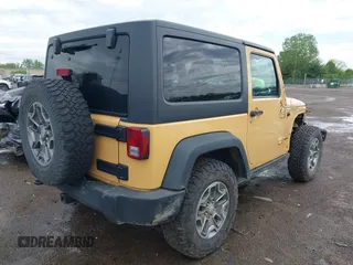 2014 Jeep Wrangler Rubicon with VIN 1C4BJWCG4EL145081, listed as a IAAI auction lot 42180723 with 113,659 mi miles and . Bid and sale history available at DreamBid. Image 4.