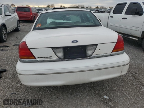 2000 Ford Crown Victoria LX z VIN 2FAFP74W4YX120352, wystawiony jako Copart lot #79833264 z przebiegiem Nie podano mil oraz Szkoda całkowita • Salvage title. Historia ofert i sprzedaży dostępna na DreamBid. Obrazek 6.
