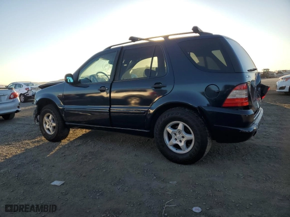 1999 Mercedes-Benz M-Class with VIN 4JGAB54E2XA106113, listed as a Copart auction lot 87996015 with 214,572 mi miles and Salvage Title. Bid and sale history available at carsss.com. Image 2.