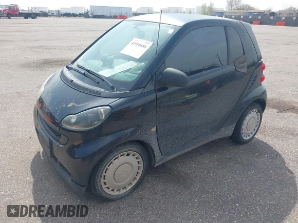 2009 Smart fortwo Pure z VIN WMEEJ31X59K312270, wystawiony jako IAAI lot #41910686 z przebiegiem 111 107 mil mil oraz . Historia ofert i sprzedaży dostępna na DreamBid. Obrazek 2.