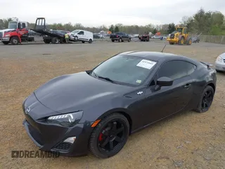 2014 Scion FR-S with VIN JF1ZNAA12E8702261, listed as a IAAI auction lot 41971045 with 124,341 mi miles and . Bid and sale history available at DreamBid. Image 2.