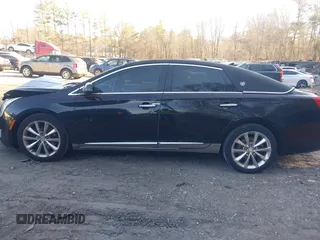 2013 Cadillac XTS Premium z VIN 2G61S5S38D9199459, wystawiony jako IAAI lot #41787638 z przebiegiem 171 298 mil mil oraz . Historia ofert i sprzedaży dostępna na DreamBid. Obrazek 14.