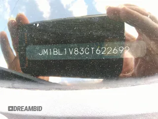 2012 Mazda 3 i Touring z VIN JM1BL1V83C1622692, wystawiony jako IAAI lot #42447571 z przebiegiem 136 065 mil mil oraz . Historia ofert i sprzedaży dostępna na DreamBid. Obrazek 9.