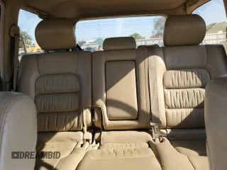 2002 Lexus LX 470 z VIN JTJHT00W723519186, wystawiony jako Copart lot #70190464 z przebiegiem 306 793 mil mil oraz Tytuł czysty. Historia ofert i sprzedaży dostępna na DreamBid. Obrazek 10.