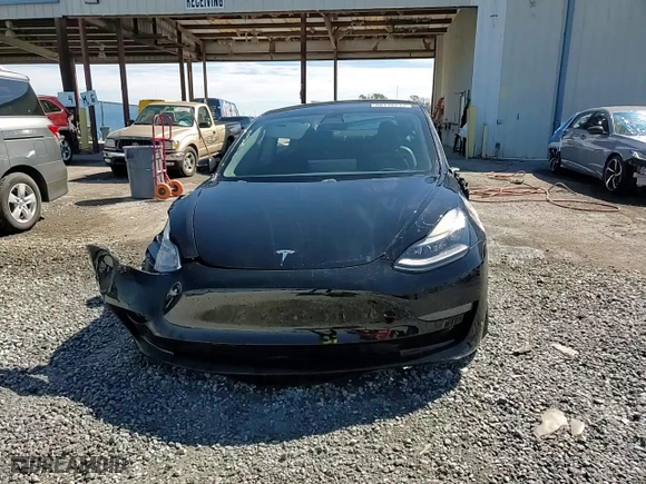 2021 Tesla Model 3 Standard Range Plus with VIN 5YJ3E1EAXMF059134, listed as a Copart auction lot 48118715 with 51,867 mi miles and Non Repairable. Bid and sale history available at carsss.com. Image 14.