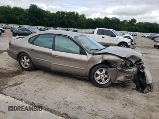 2005 Ford Taurus SE with VIN 1FAFP53205A252967, listed as a Copart auction lot 58449495 with Not provided miles and Salvage title. Bid and sale history available at DreamBid. Image 4.